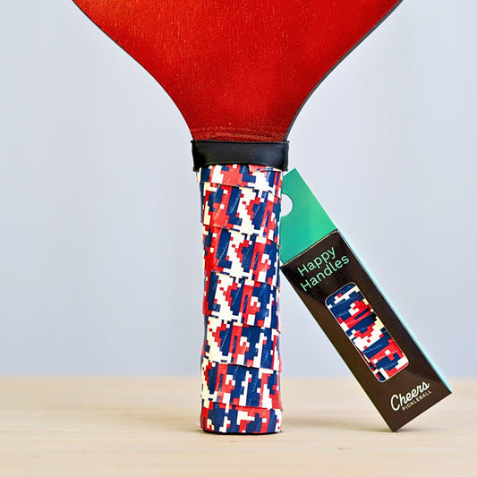 Happy Handles Digital Camo Pickleball Grip in red, blue, and white digital camo, displayed on a paddle