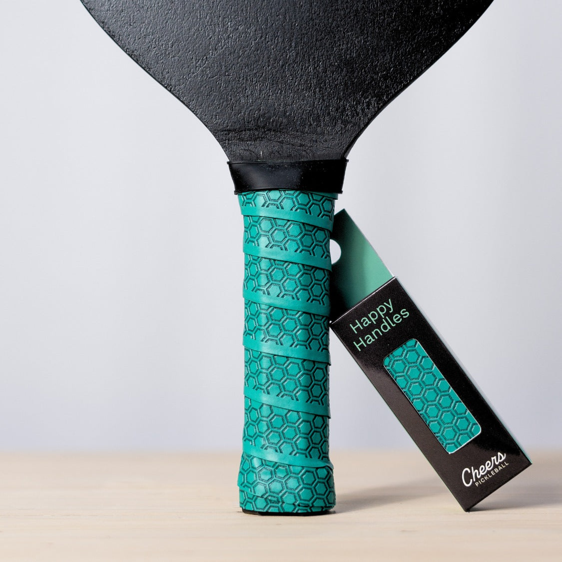 Happy Handles Pure Lagoon with with hexagon textured design displayed on a paddle