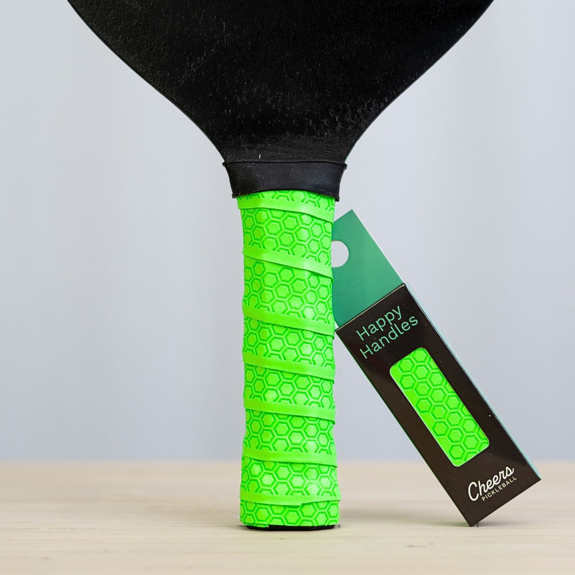 Happy Handles Pure Neon Green with with hexagon textured design displayed on a paddle