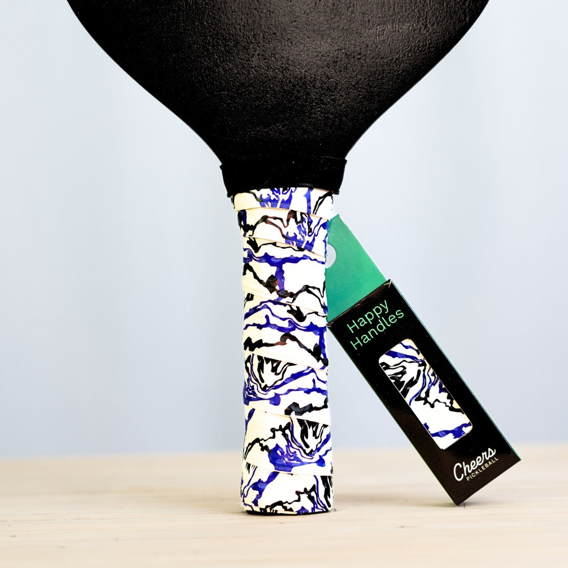 Happy Handles Paint Swirl, White with with purple and black paint swirl design displayed on a paddle