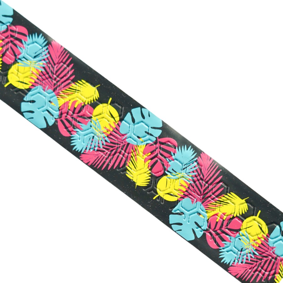 Close-up of Happy Handles Rainforest Pickleball Grip featuring yellow, pink, and blue tropical leafy pattern with black background